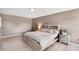 Spacious main bedroom with cozy carpet, neutral walls, and a large comfortable bed at 2861 Pond View Dr, Haines City, FL 33844