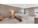 Relaxing main bedroom with carpet, neutral walls, and a comfortable bed and side tables at 2861 Pond View Dr, Haines City, FL 33844