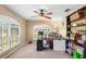 Bright office with a ceiling fan, shutters, and lots of natural light at 2861 Pond View Dr, Haines City, FL 33844
