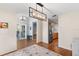 Open concept floor plan offering views of the kitchen and den with hardwood floors at 2861 Pond View Dr, Haines City, FL 33844