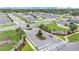 Aerial view of the gated community entrance sign with pristine landscaping and tree-lined streets at 308 Kissengen Park Dr, Bartow, FL 33830
