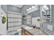 Charming bathroom featuring vanity with granite counters and shower with decorative curtain at 308 Kissengen Park Dr, Bartow, FL 33830