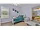 Charming bedroom with a plush rug, a window that offers natural light and an adjacent workspace at 308 Kissengen Park Dr, Bartow, FL 33830