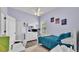 Cozy bedroom features a ceiling fan, hardwood floors and a window that offers plenty of natural light at 308 Kissengen Park Dr, Bartow, FL 33830