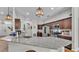 Well-equipped kitchen with stainless steel appliances, granite countertops, ample cabinet space, and stylish pendant lighting at 308 Kissengen Park Dr, Bartow, FL 33830
