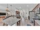Open kitchen featuring a granite island with barstool seating and stainless appliances at 308 Kissengen Park Dr, Bartow, FL 33830
