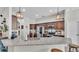 Well-equipped kitchen with stainless steel appliances, granite countertops, ample cabinet space, and stylish pendant lighting at 308 Kissengen Park Dr, Bartow, FL 33830