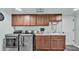 Well-equipped laundry room featuring matching appliances and ample storage cabinets at 308 Kissengen Park Dr, Bartow, FL 33830