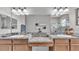 Main bathroom featuring double sink vanity, bathtub and a glass enclosed shower at 308 Kissengen Park Dr, Bartow, FL 33830