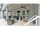 Covered screened-in lanai with ceiling fans provides space for outdoor dining and lounging at 308 Kissengen Park Dr, Bartow, FL 33830