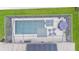 Aerial view of a screened-in pool featuring solar panels, adjacent to a spa and outdoor seating at 308 Kissengen Park Dr, Bartow, FL 33830