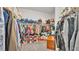 Walk-in closet featuring shelving, hanging racks, carpet, and storage at 308 Kissengen Park Dr, Bartow, FL 33830