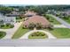Beautiful home featuring an inviting circular driveway and lush green lawn at 328 Hamilton Shores Ne Dr, Winter Haven, FL 33881