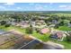 Aerial view of a lakeside community featuring manicured lawns and private pools at 328 Hamilton Shores Ne Dr, Winter Haven, FL 33881