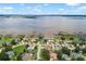 Beautiful aerial view of waterfront homes with private docks on a sunny day at 328 Hamilton Shores Ne Dr, Winter Haven, FL 33881