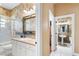 Well-maintained bathroom featuring dual sinks and classic fixtures at 328 Hamilton Shores Ne Dr, Winter Haven, FL 33881