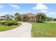 Charming single-story home with well-maintained landscaping and a circular driveway at 328 Hamilton Shores Ne Dr, Winter Haven, FL 33881