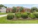 Charming front exterior showcasing manicured landscaping and inviting curb appeal at 328 Hamilton Shores Ne Dr, Winter Haven, FL 33881