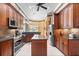 Spacious kitchen with stainless steel appliances, granite countertops, and ample cabinet space at 328 Hamilton Shores Ne Dr, Winter Haven, FL 33881
