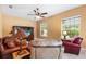Comfortable living room area with ceiling fan and natural light at 328 Hamilton Shores Ne Dr, Winter Haven, FL 33881