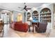 Comfortable living room with a large leather sofa and built-in shelving at 328 Hamilton Shores Ne Dr, Winter Haven, FL 33881