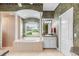 Relaxing main bathroom with soaking tub, separate shower, and dual vanities at 328 Hamilton Shores Ne Dr, Winter Haven, FL 33881