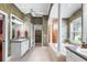 Elegant bathroom with a soaking tub, dual vanities, and a separate shower at 328 Hamilton Shores Ne Dr, Winter Haven, FL 33881
