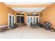 Covered patio features dual ceiling fans, ample seating, and an outdoor grill for entertaining at 328 Hamilton Shores Ne Dr, Winter Haven, FL 33881
