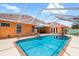 Enjoy the pool with a screened enclosure, patio seating, and access to the home at 328 Hamilton Shores Ne Dr, Winter Haven, FL 33881