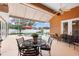 Screened-in pool area with outdoor seating offers a refreshing retreat in a private backyard at 328 Hamilton Shores Ne Dr, Winter Haven, FL 33881