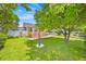 Spacious backyard featuring lush green grass, mature trees, and a charming vintage-style lamp post at 345 Avenue J Se, Winter Haven, FL 33880