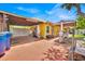 This backyard features a covered patio, perfect for entertaining guests or enjoying a quiet evening at 345 Avenue J Se, Winter Haven, FL 33880