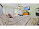 Bright bedroom with green walls, light blocking shades, and a comfy bed with storage space at 345 Avenue J Se, Winter Haven, FL 33880