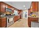 Modern kitchen featuring stainless steel appliances, dark wood cabinetry, and granite countertops at 345 Avenue J Se, Winter Haven, FL 33880
