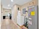Functional laundry room with washer, dryer, and ample storage space at 345 Avenue J Se, Winter Haven, FL 33880