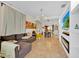 Open-concept living space with tile flooring, modern fireplace, and bright natural light at 345 Avenue J Se, Winter Haven, FL 33880