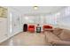Inviting entry with tile floors, bright natural light and cozy seating arrangement with pops of color at 345 Avenue J Se, Winter Haven, FL 33880