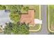 A top-down shot of a home featuring a well-manicured lawn and a long driveway in a tranquil neighborhood at 3717 Tigereye Ct, Mulberry, FL 33860