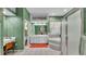 Main bathroom with tub, walk in shower, and large vanity at 3717 Tigereye Ct, Mulberry, FL 33860
