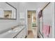 Well-lit bathroom featuring a sink and a shower with a doorway that leads to a bedroom at 3717 Tigereye Ct, Mulberry, FL 33860