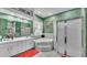 Primary bathroom featuring a tub, shower, and a double sink vanity at 3717 Tigereye Ct, Mulberry, FL 33860