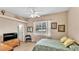 Inviting bedroom with a ceiling fan, and a window with blinds allowing natural light at 3717 Tigereye Ct, Mulberry, FL 33860