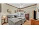 Charming bedroom featuring two twin beds, a ceiling fan, and detailed decorative trim at 3717 Tigereye Ct, Mulberry, FL 33860