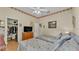 Well-lit bedroom offering two cozy beds, built-in closet, and a classic wooden dresser at 3717 Tigereye Ct, Mulberry, FL 33860