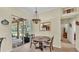 Charming breakfast nook adjacent to a screened lanai, enhanced by a decorative light fixture at 3717 Tigereye Ct, Mulberry, FL 33860