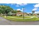 Well-maintained home with a neatly landscaped lawn and a paved walkway that curves from the street to the driveway at 3717 Tigereye Ct, Mulberry, FL 33860