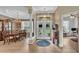 Inviting foyer with a view of the dining room to the left and an office to the right, showcasing beautiful flooring at 3717 Tigereye Ct, Mulberry, FL 33860