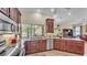 View of kitchen featuring granite countertops, stainless appliances, and a window at 3717 Tigereye Ct, Mulberry, FL 33860