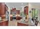 Kitchen with granite countertops, stainless appliances, and island with bar seating at 3717 Tigereye Ct, Mulberry, FL 33860