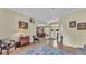 Spacious living room featuring hardwood floors, neutral paint, and an open layout for flexible living at 3717 Tigereye Ct, Mulberry, FL 33860
